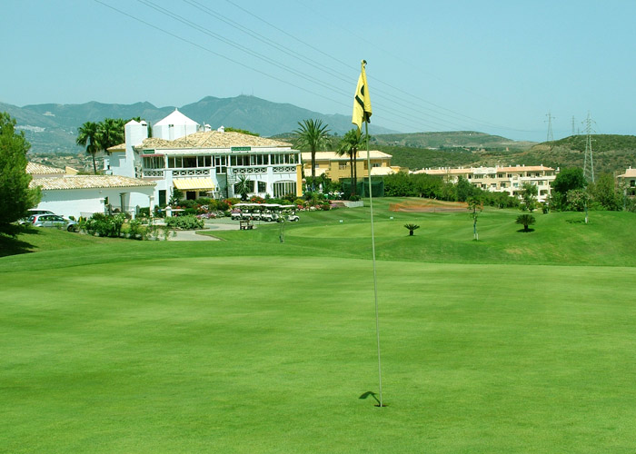 Miraflores Golf green with clubhouse in background