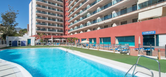 Swimming pool at the Principe Apartments with light blue crystal blue water.